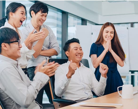 A team collaborating in a modern office environment, discussing Google solutions from Ingram Micro.